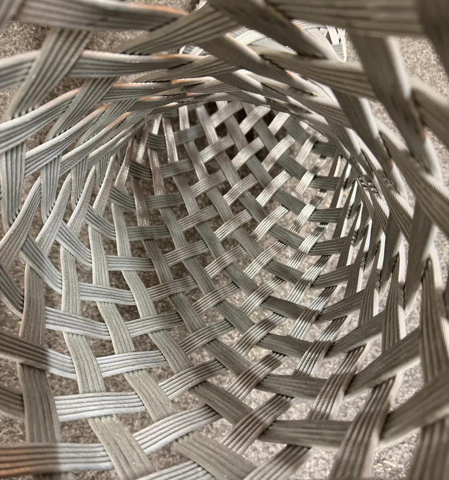 The mesh of a braided grip, photographed from the inside